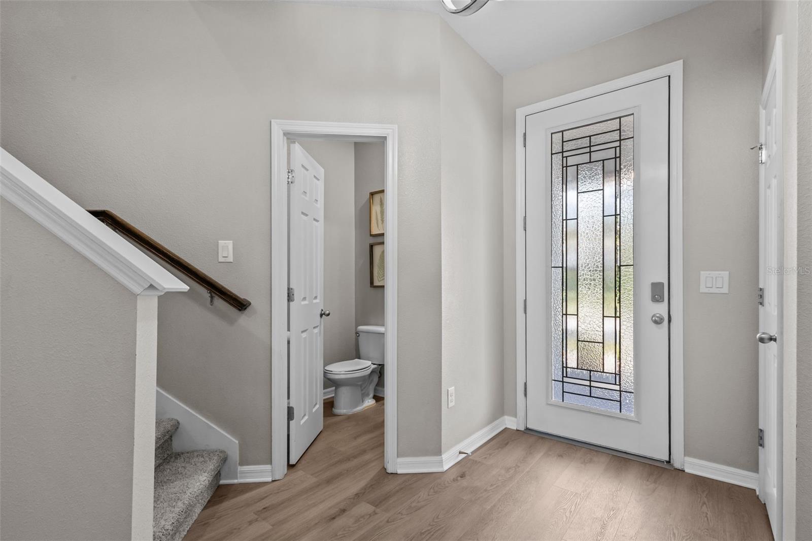 Welcoming foyer includes a convenient coat closet for everyday storage
