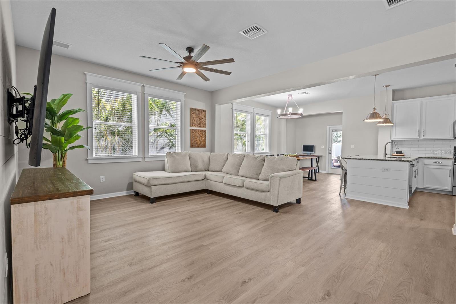 Luxury vinyl plank flooring and cohesive finishes give the main living area a polished feel