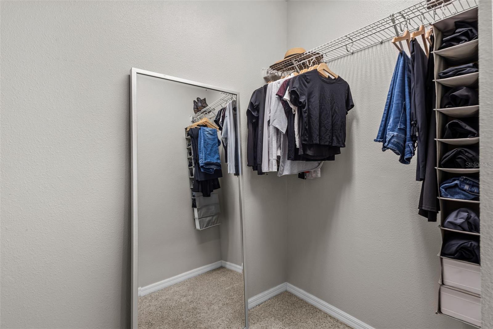 Large walk-in closet provides generous storage within the primary suite