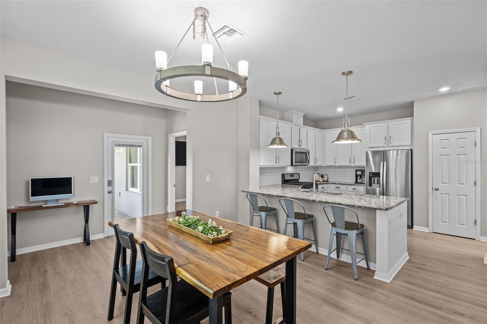 Open dining space creates an easy connection between the kitchen and living room.