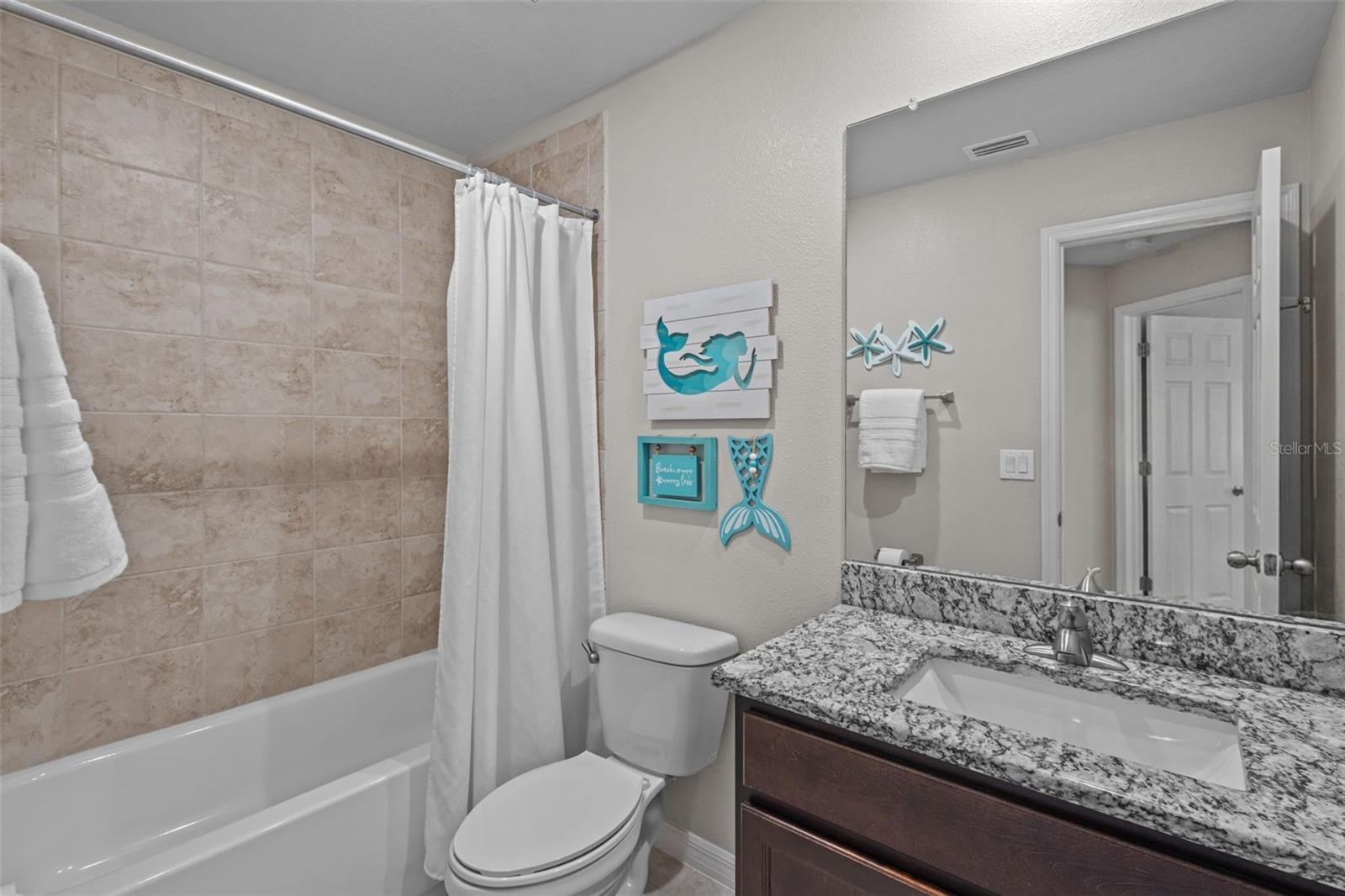 Two full upstairs bathrooms provide added convenience for the secondary bedrooms and loft.