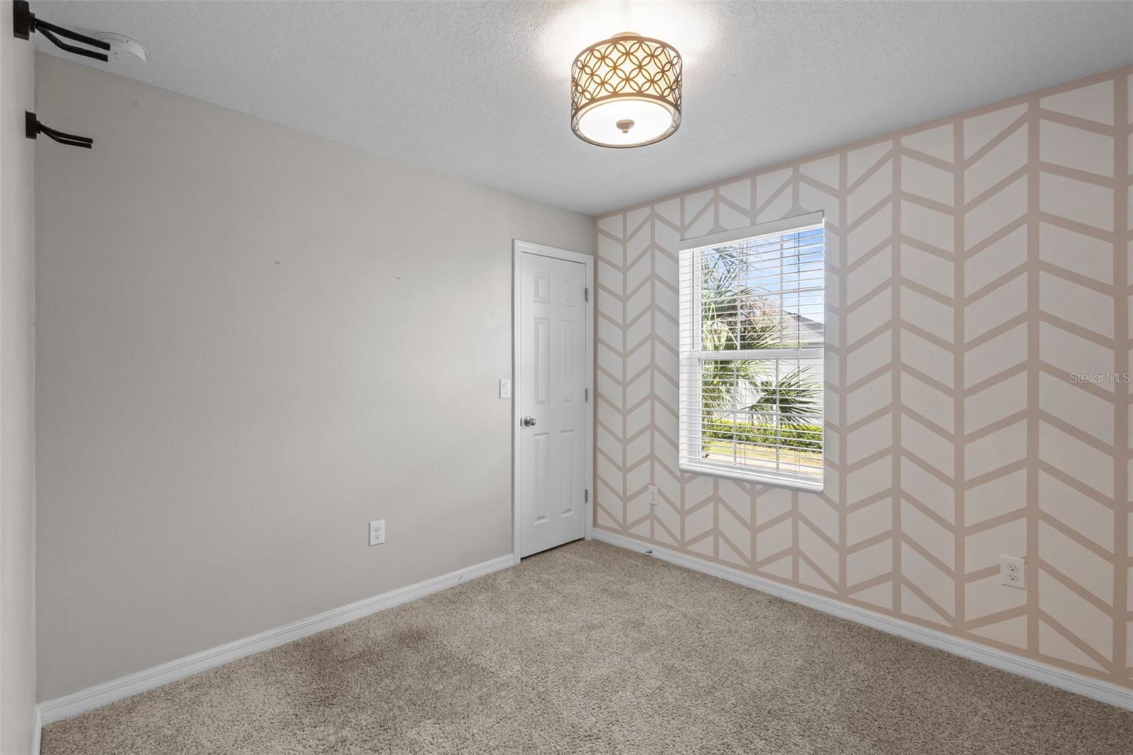One upstairs bedroom includes a walk-in closet for additional storage