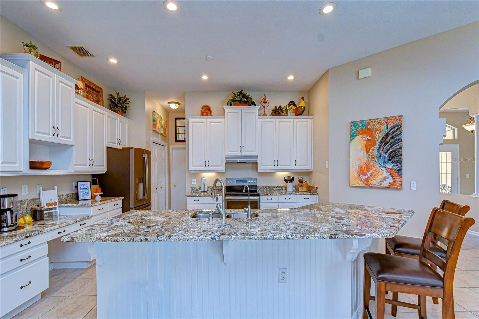 Stunning upgraded kitchen serving as the centerpiece of the home.
