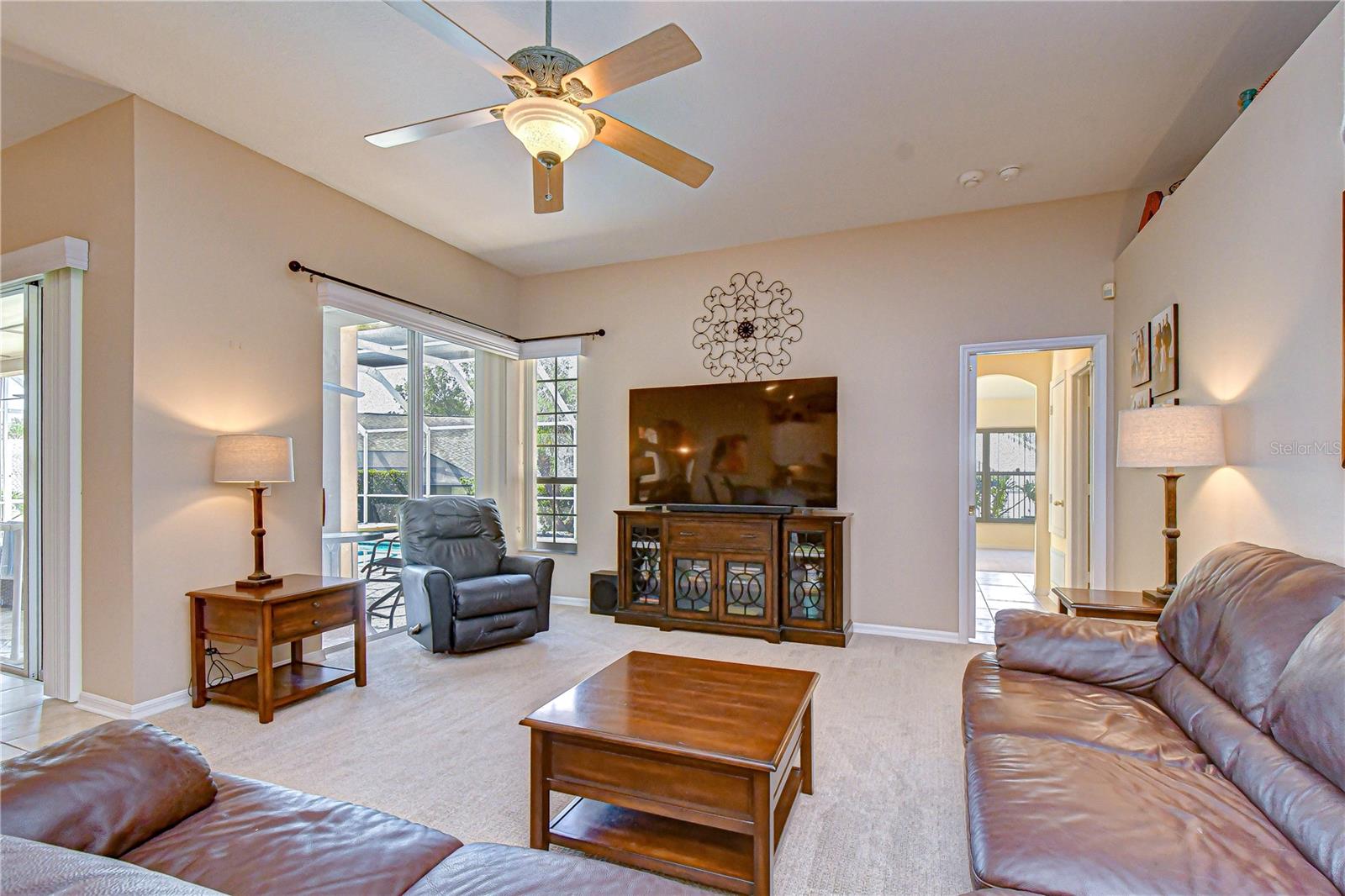 Spacious living area connected directly to kitchen and outdoor spaces.