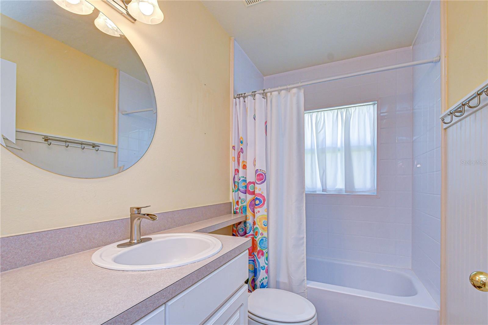Additional full bath providing convenience and privacy.