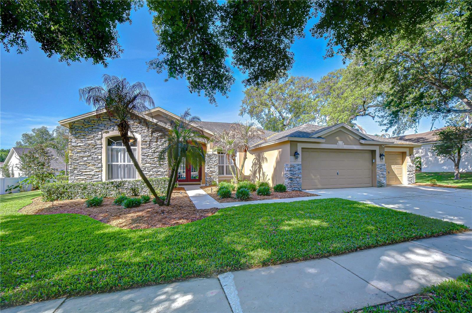 Spacious driveway leading to attached garage.