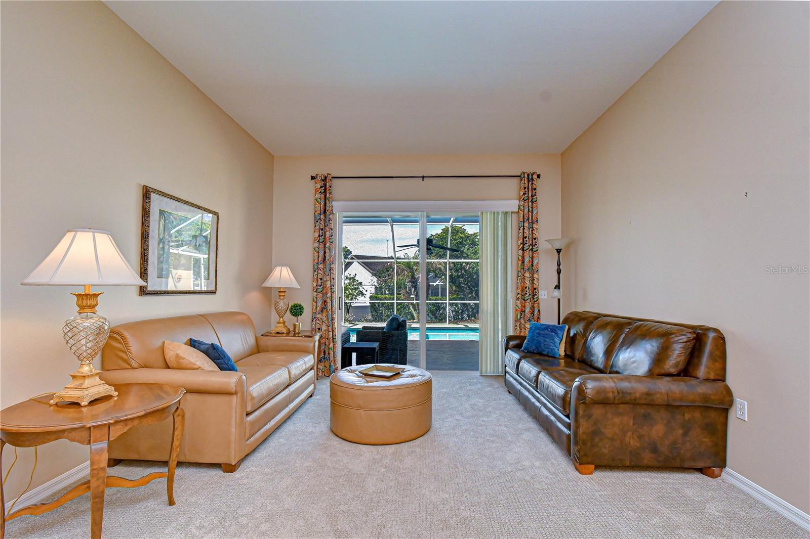 Expansive sliding doors showcasing pool views.