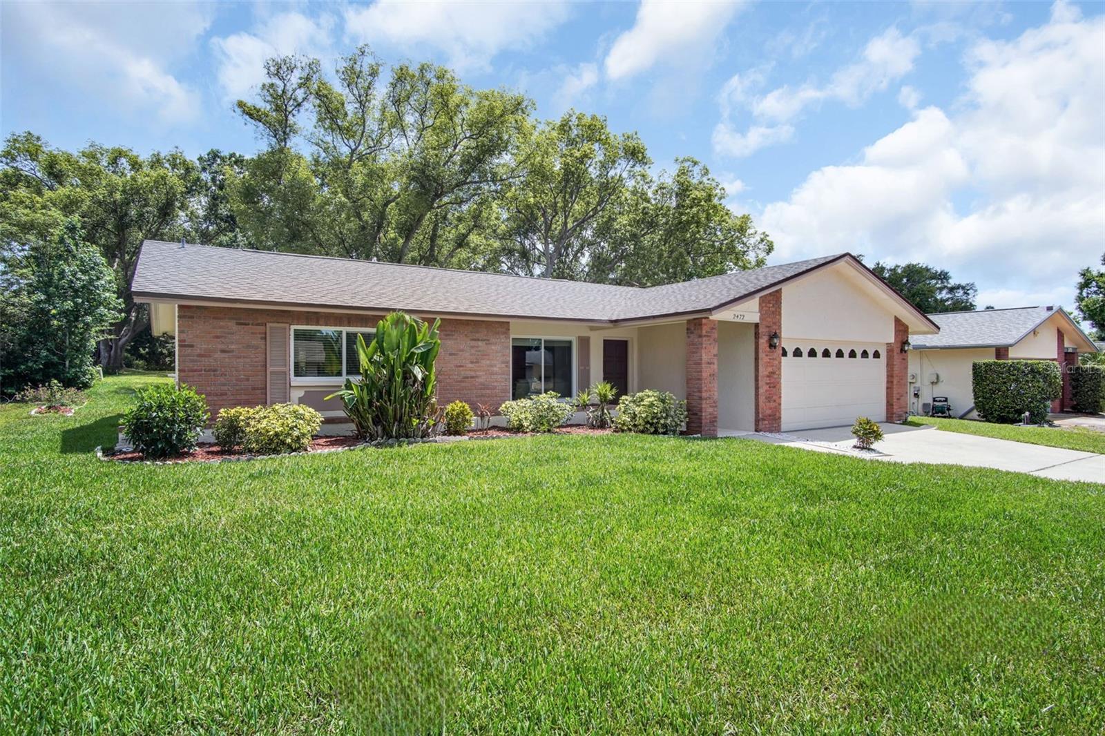 NEW lush lawn, freshly painted exterior, and NEW 2023 ROOF~