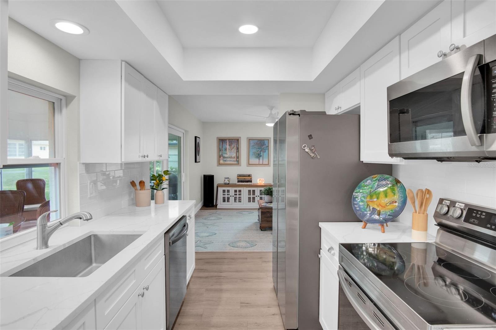 Quartz countertops, deep sink, and updated soft close cabinetry~