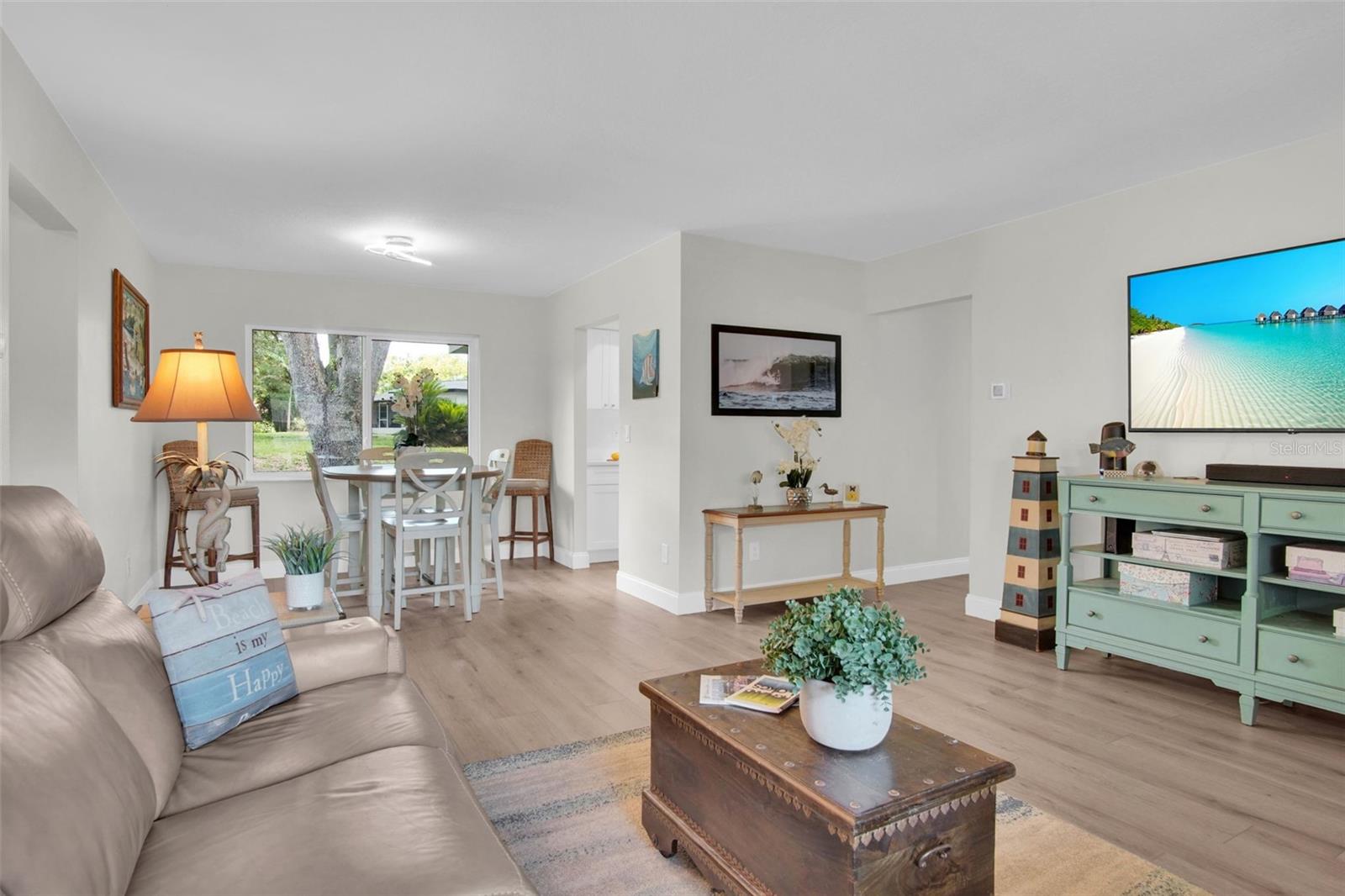 Natural light immediately floods the open spaces upon entry~
