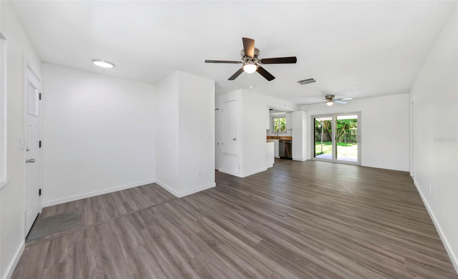 Enter into large open great room with wall-to-wall luxury vinyl flooring