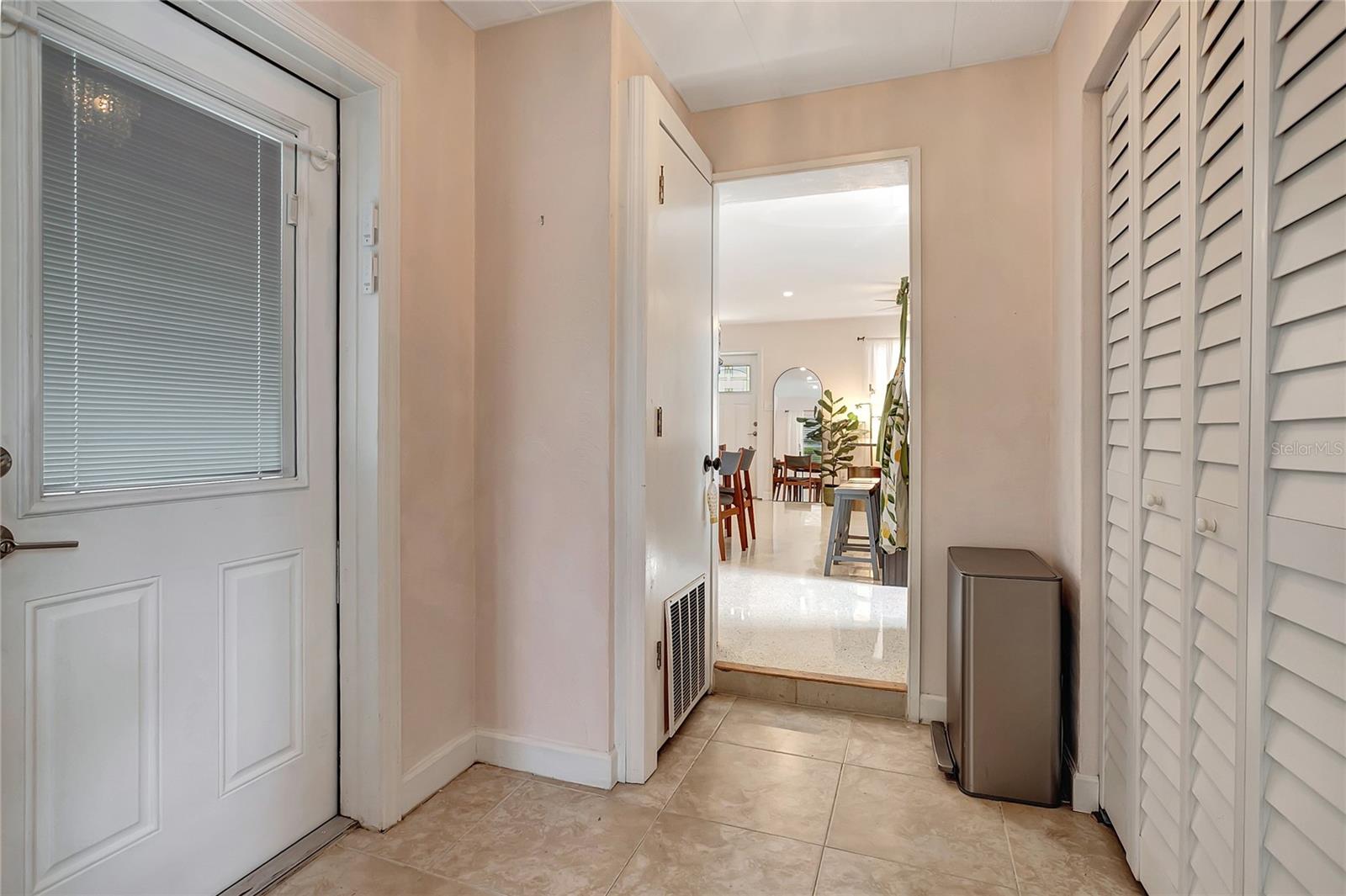door to exterior on left and door to laundry area on right