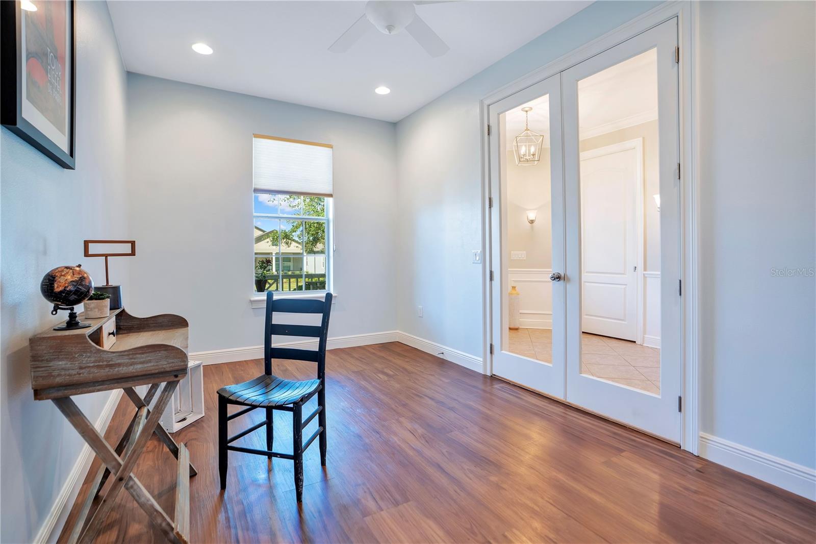 Versatile flex room/office with glass French doors located off the foyer.
