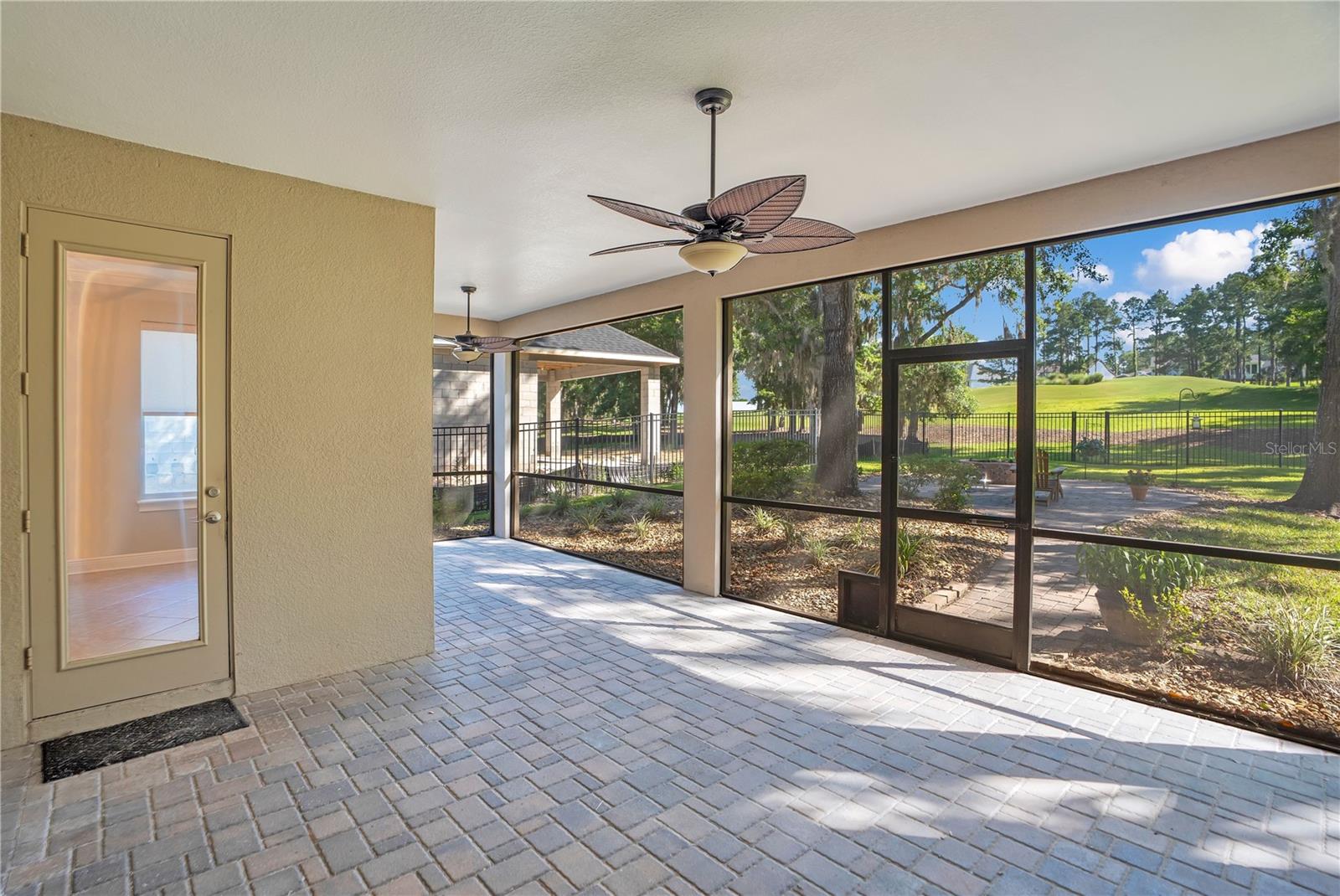 Screen Enclosed Lanai Overlooking Golf Course.