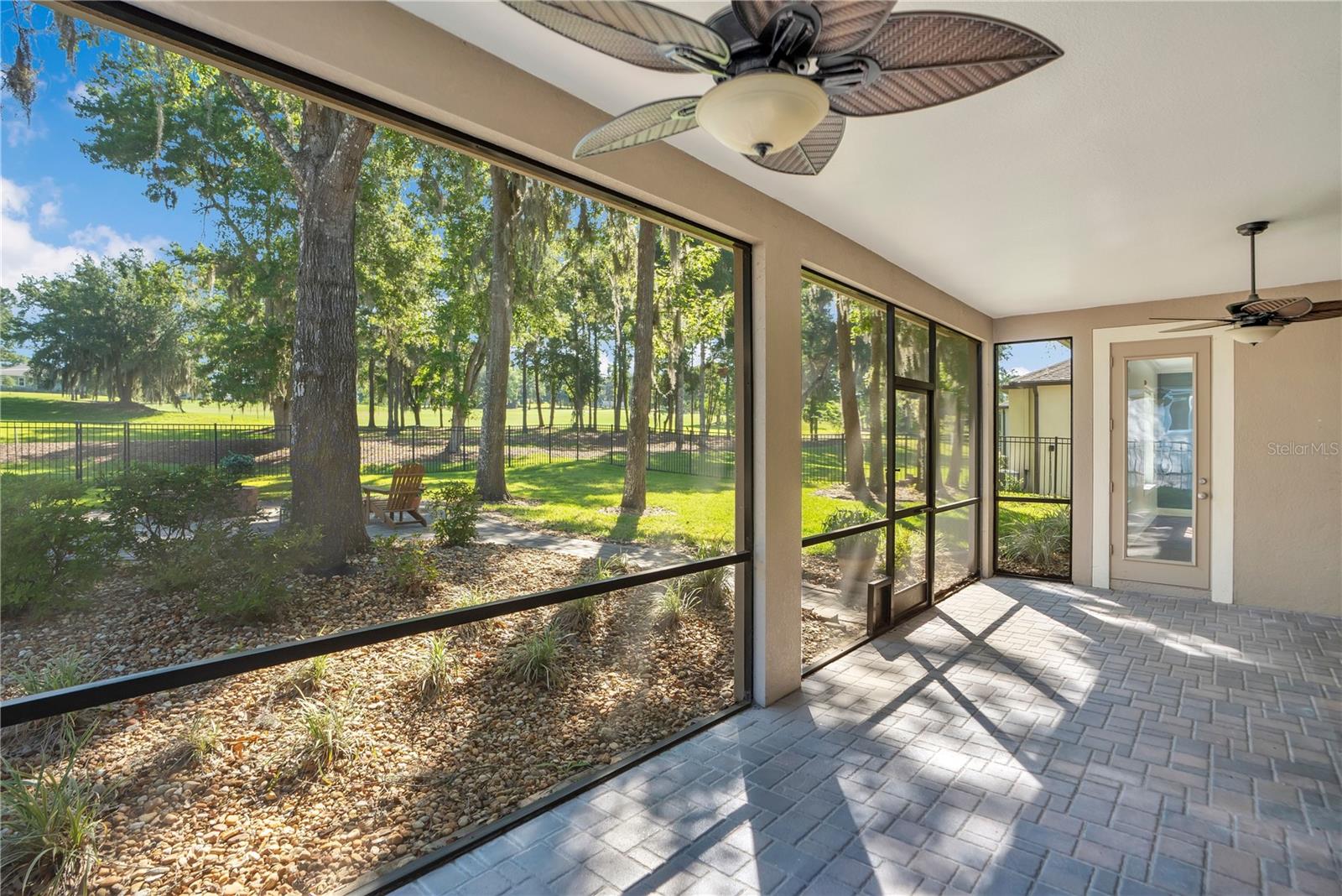 Screen Enclosed Lanai Overlooking Golf Course.