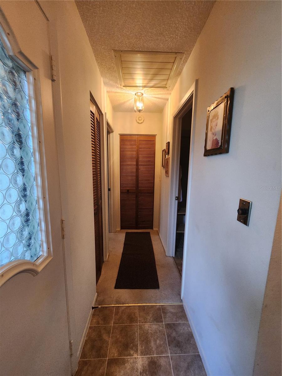 Left front hallway leading to bedroom 2 and bathroom