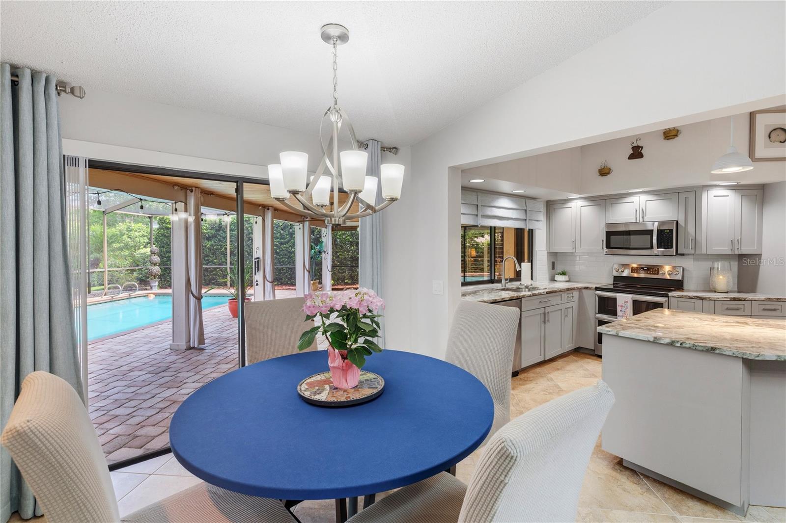 Kitchen, casual eat-in dining area overlooking the lanai and pool.