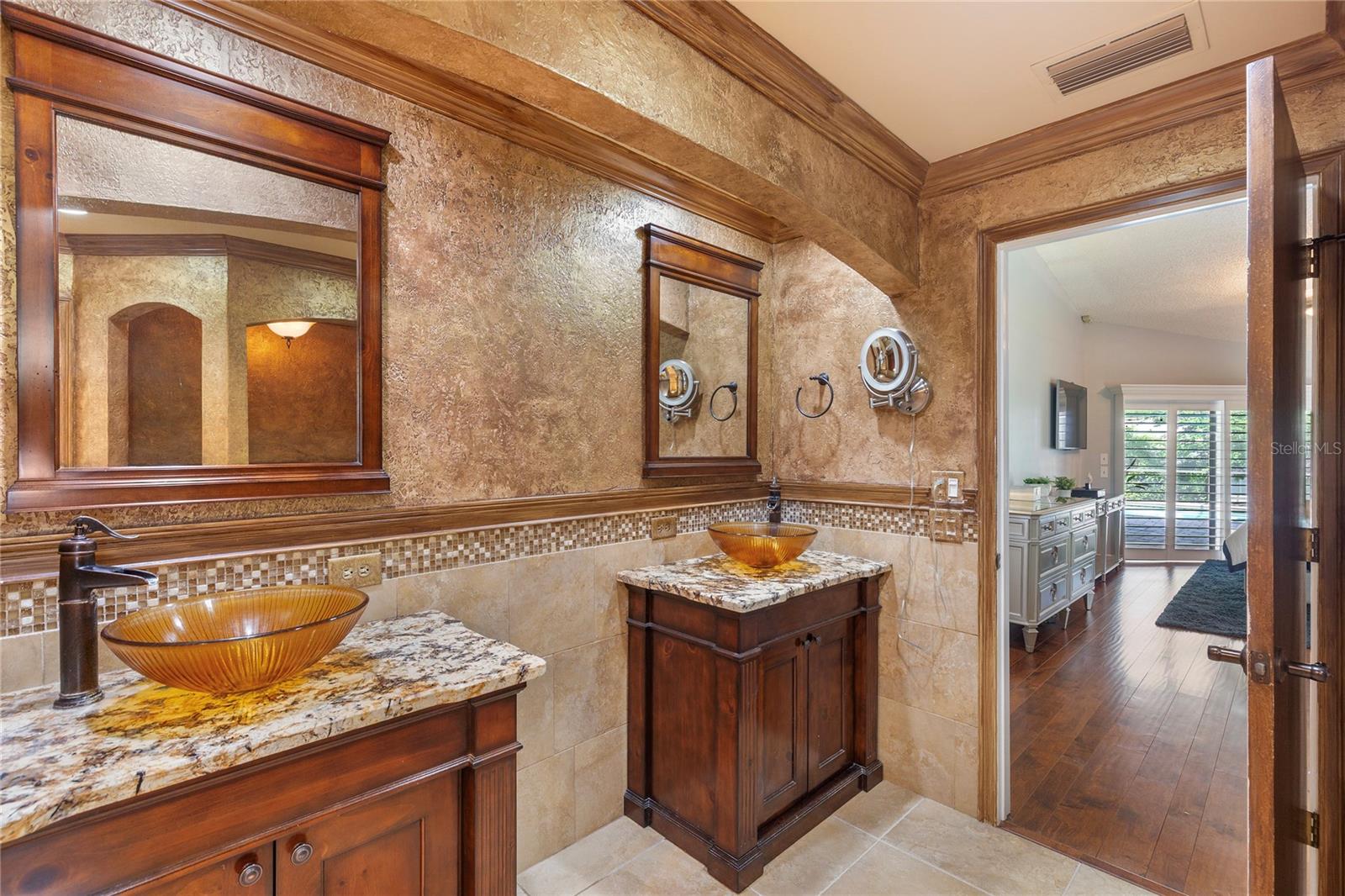 His and her sink cabinets looking into master bedroom