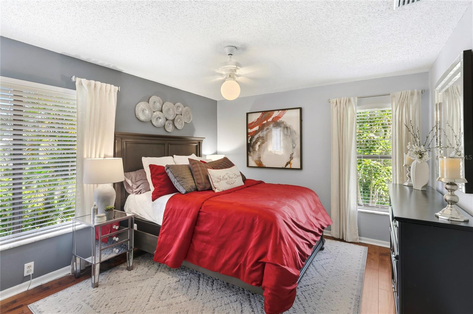Well-lit guest bedroom in the rear of the home