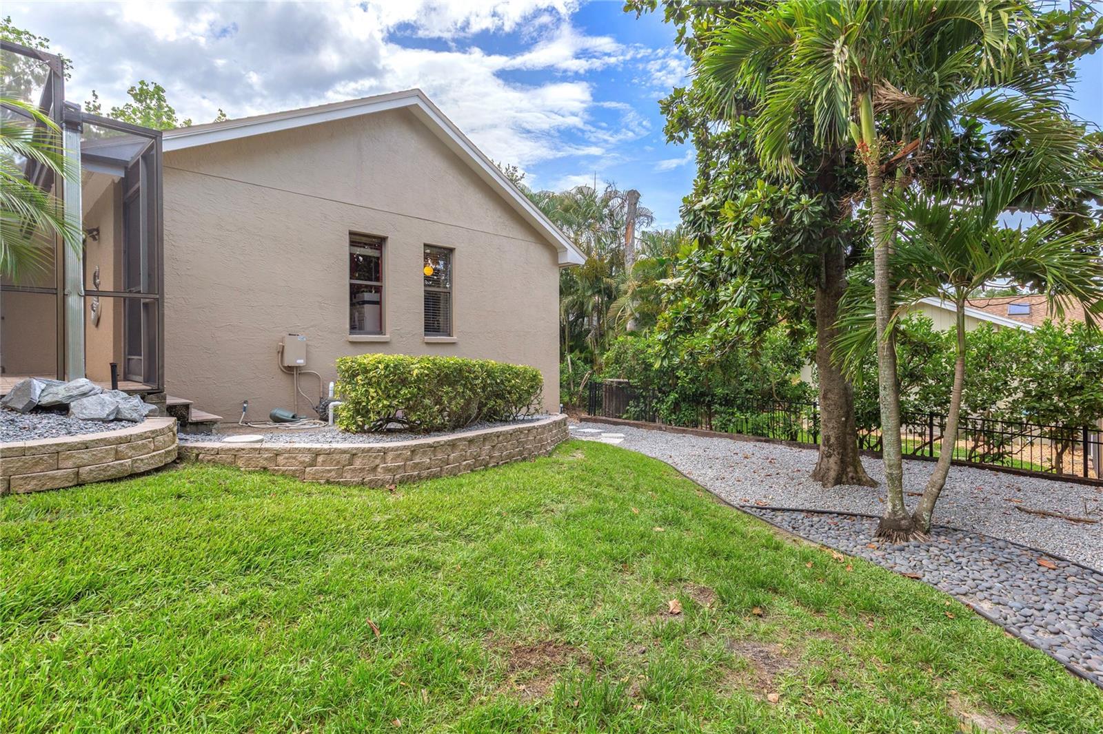 Low-maintenance landscaping, featuring large decorative rocks for a clean, natural, and easy-care backyard.