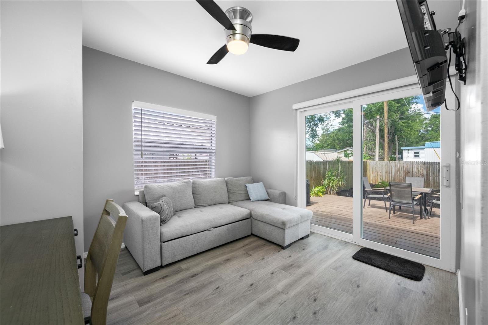 Bedroom 3 / Office with built in closet and slider opening to the back deck.
