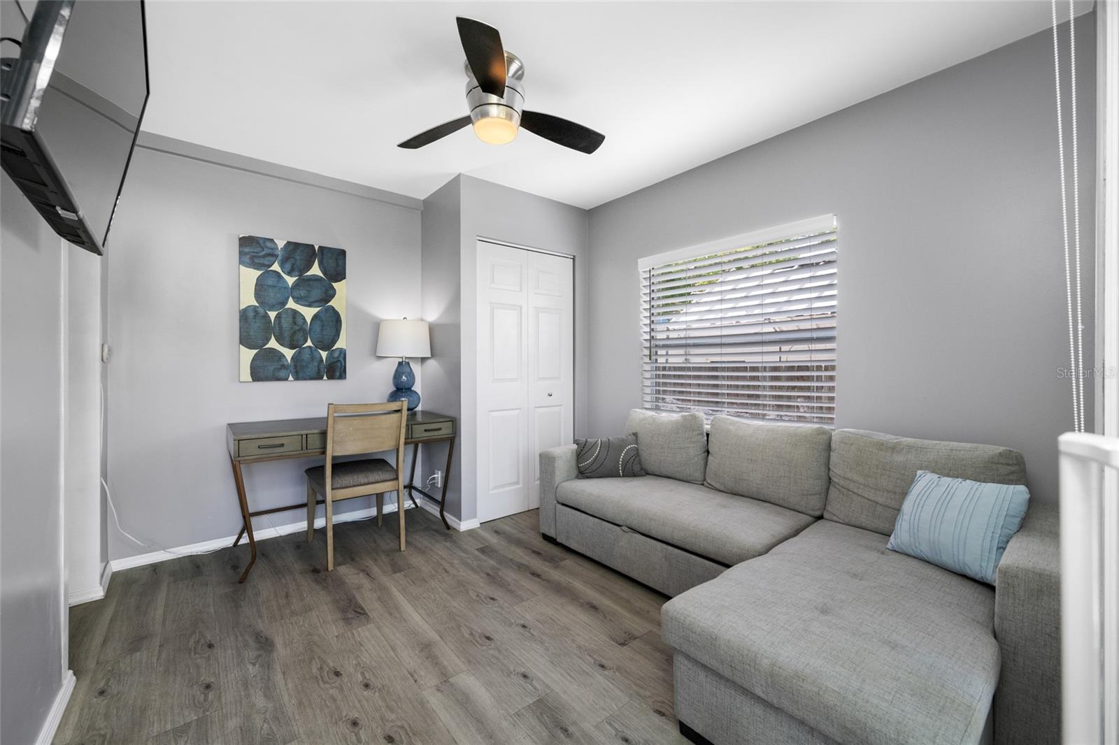 Bedroom 3 / Office with built in closet and slider opening to the back deck.