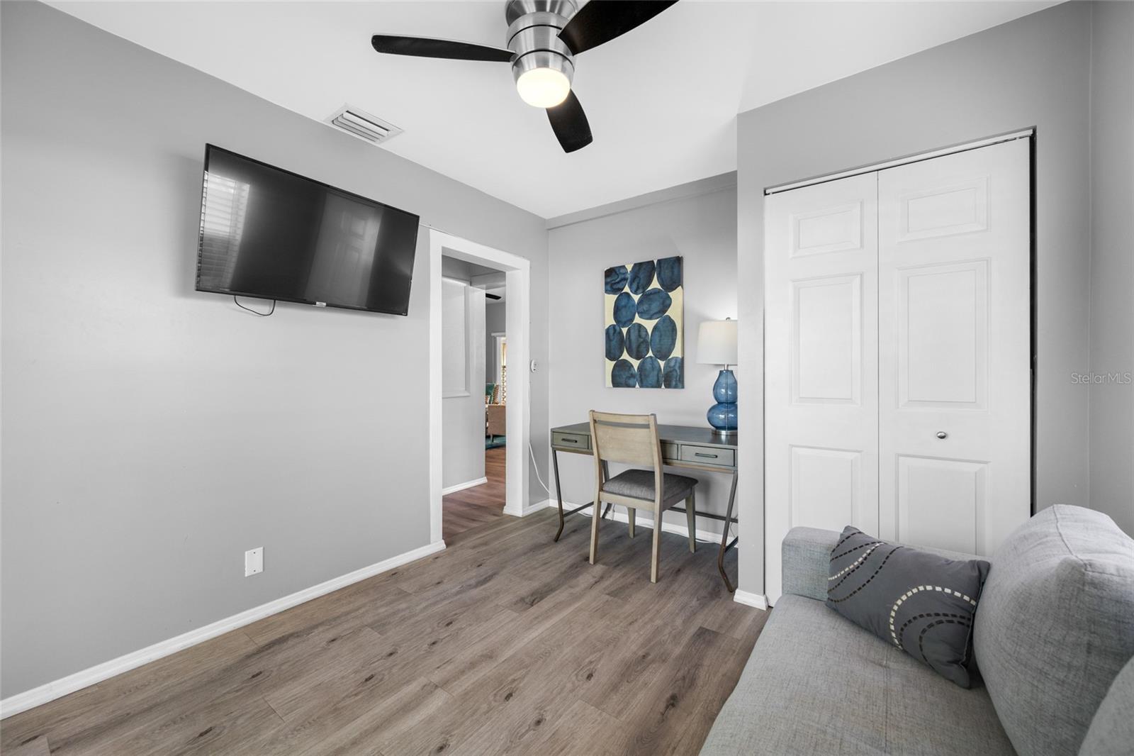 Bedroom 3 / Office with built in closet and slider opening to the back deck.