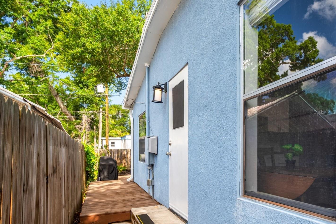 Side door from kitchen to deck and back yard.