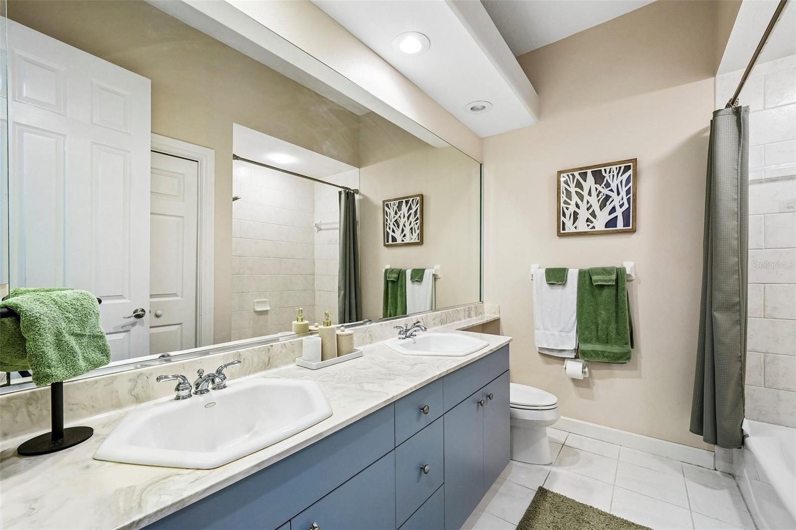 Third bathroom with tub located upstairs