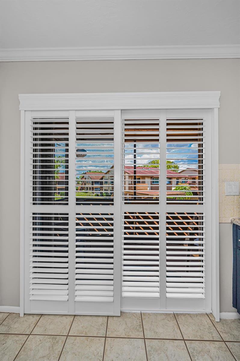 Sliders in the kitchen to the front screened in Balcony