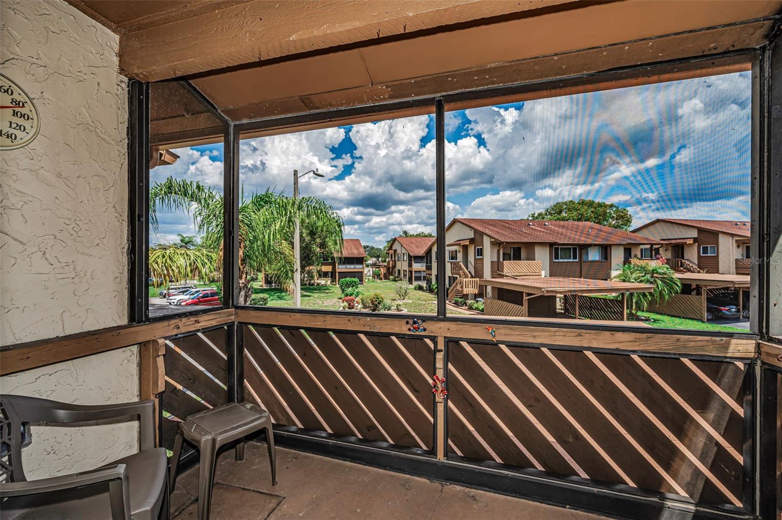 Front Screened in Balcony with Common Area Greenbelt view