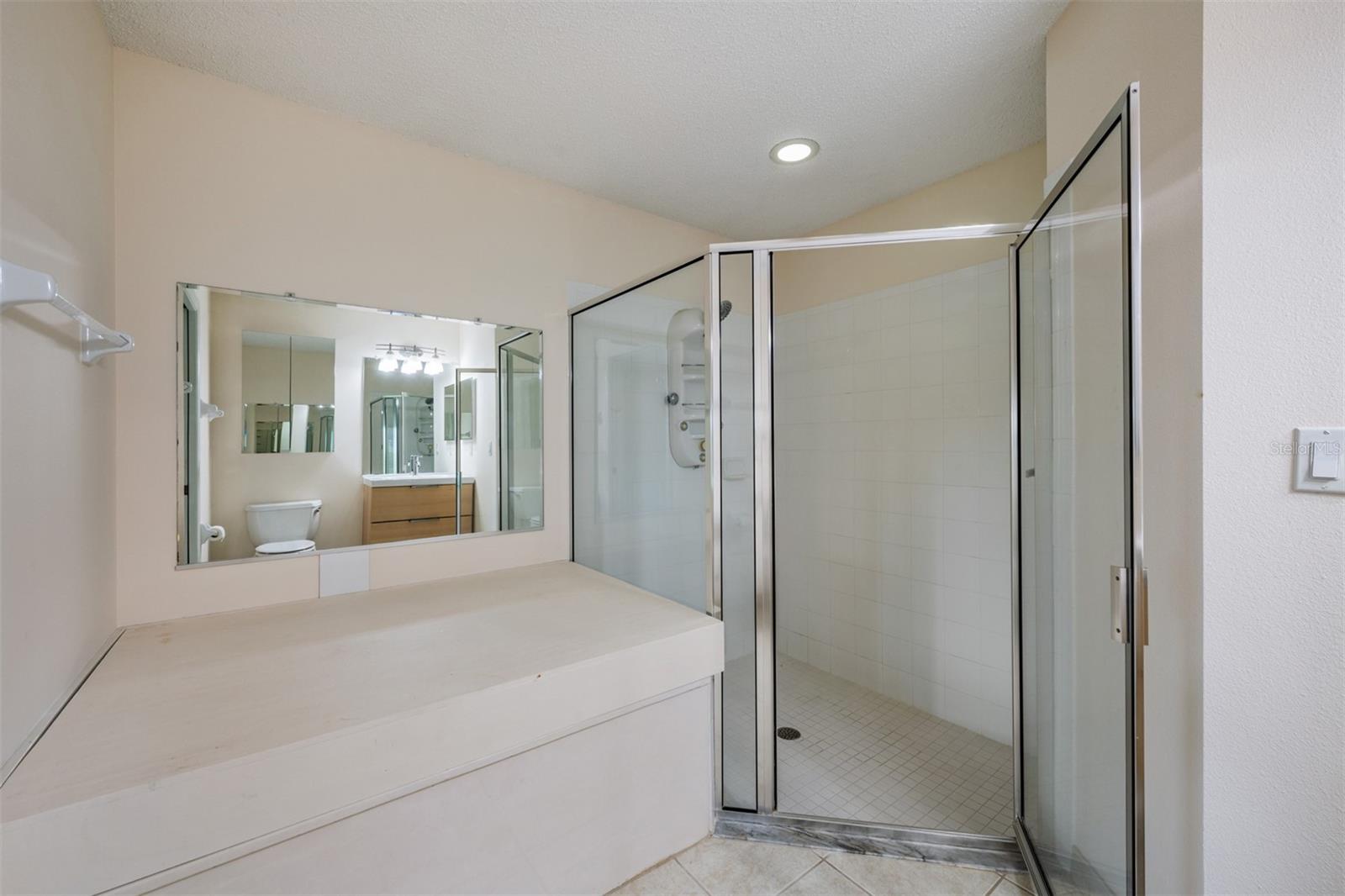 Soaking tub with cover in Primary bathroom