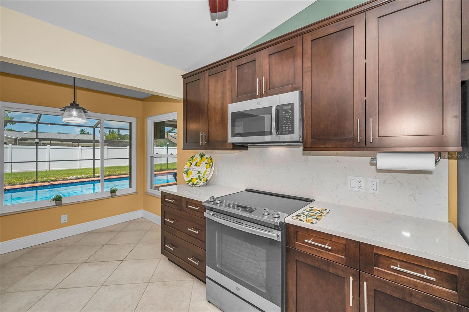 Updated open kitchen with stainless appliances