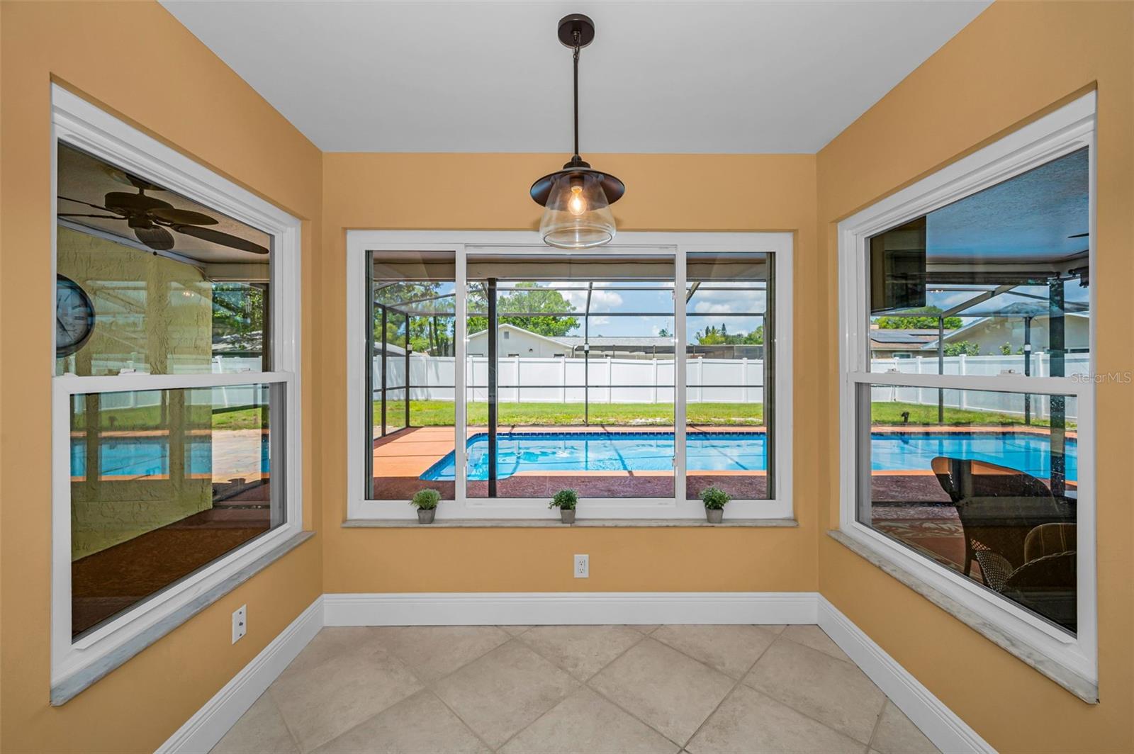 Dining nook off kitchen with great pool views