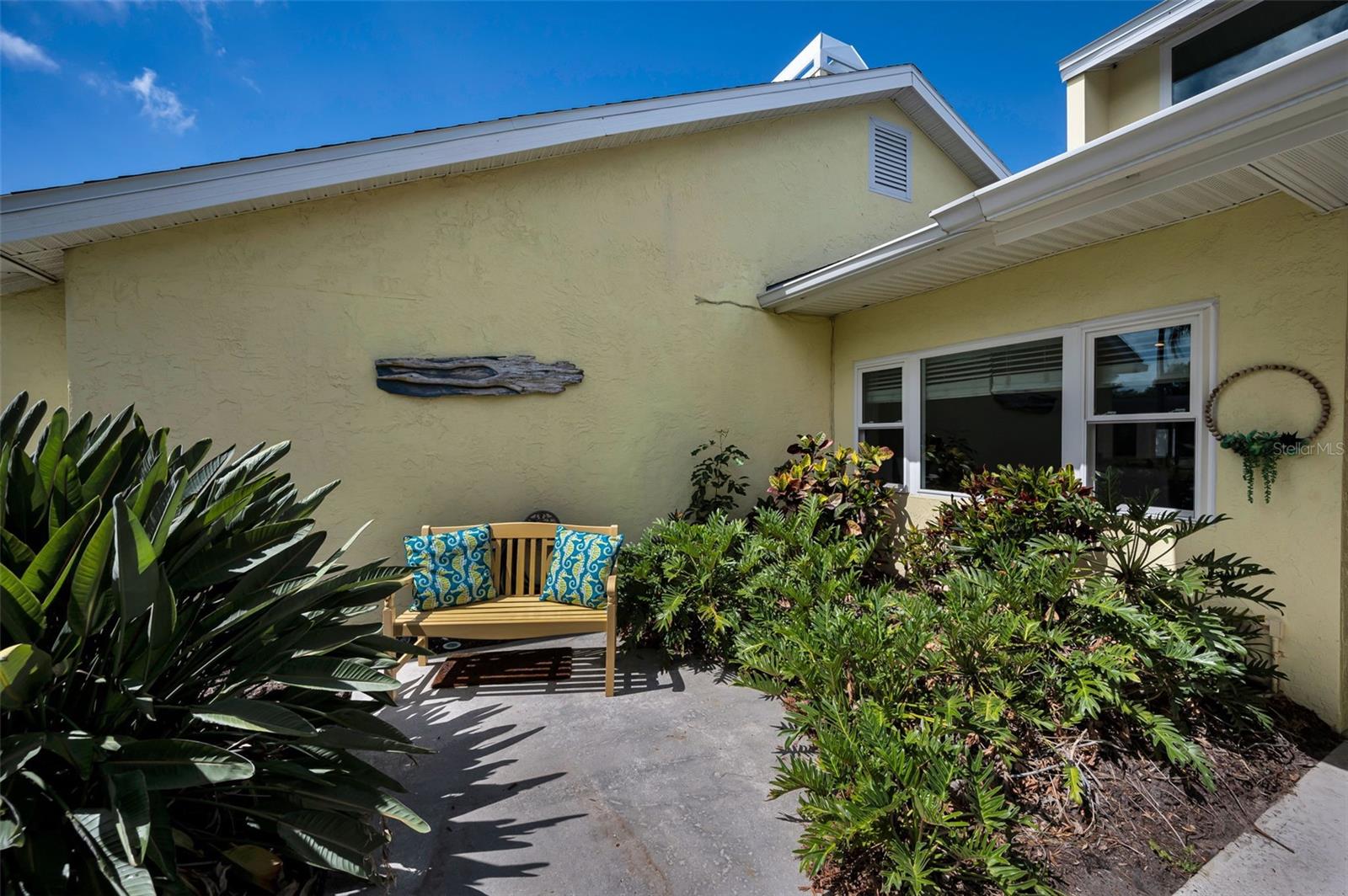 Front patio with lush landscaping
