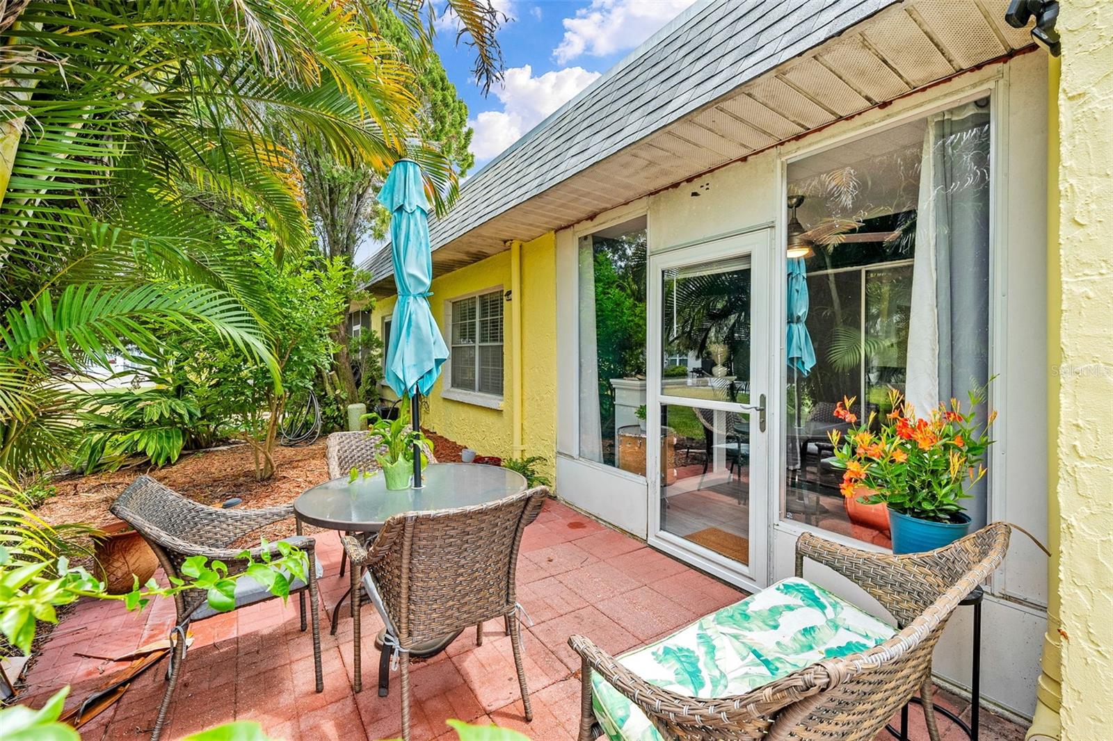 Lush tropical pavered patio