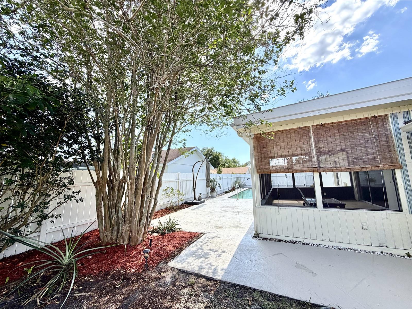 Screened Patio overlooks pool area