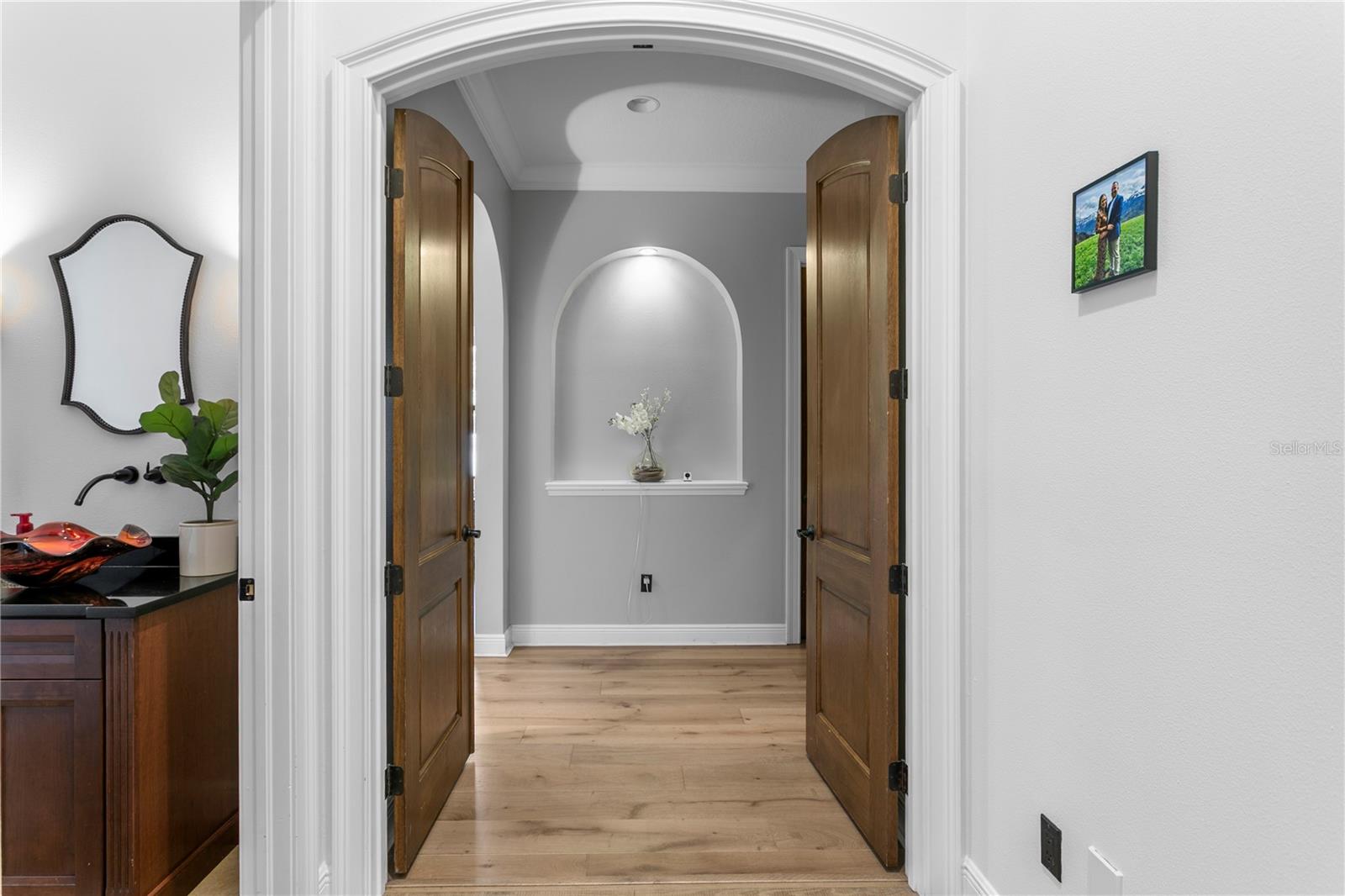Primary suite with double door entrance.