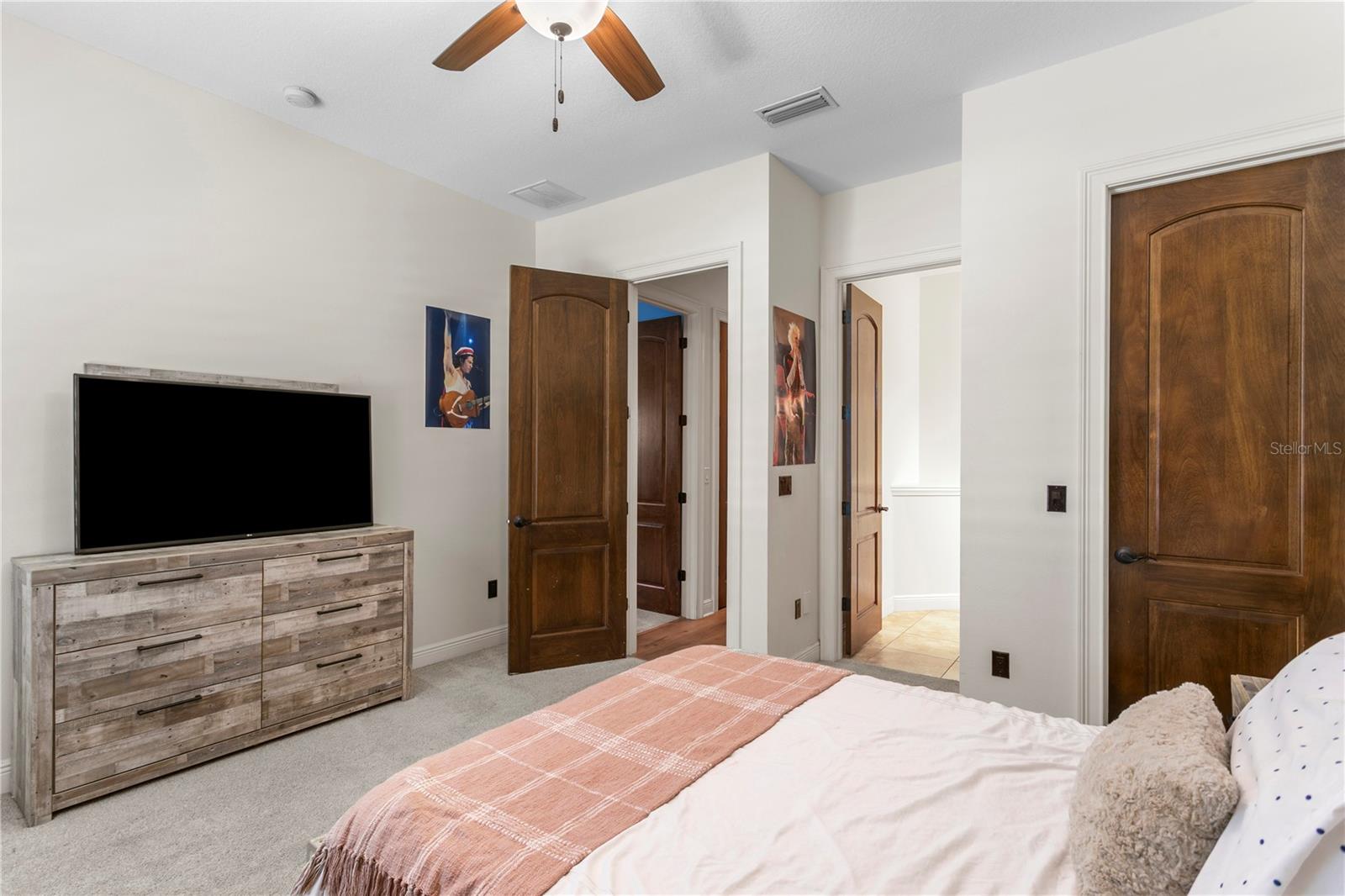 Secondary bedroom with walk-in closet and bathroom.