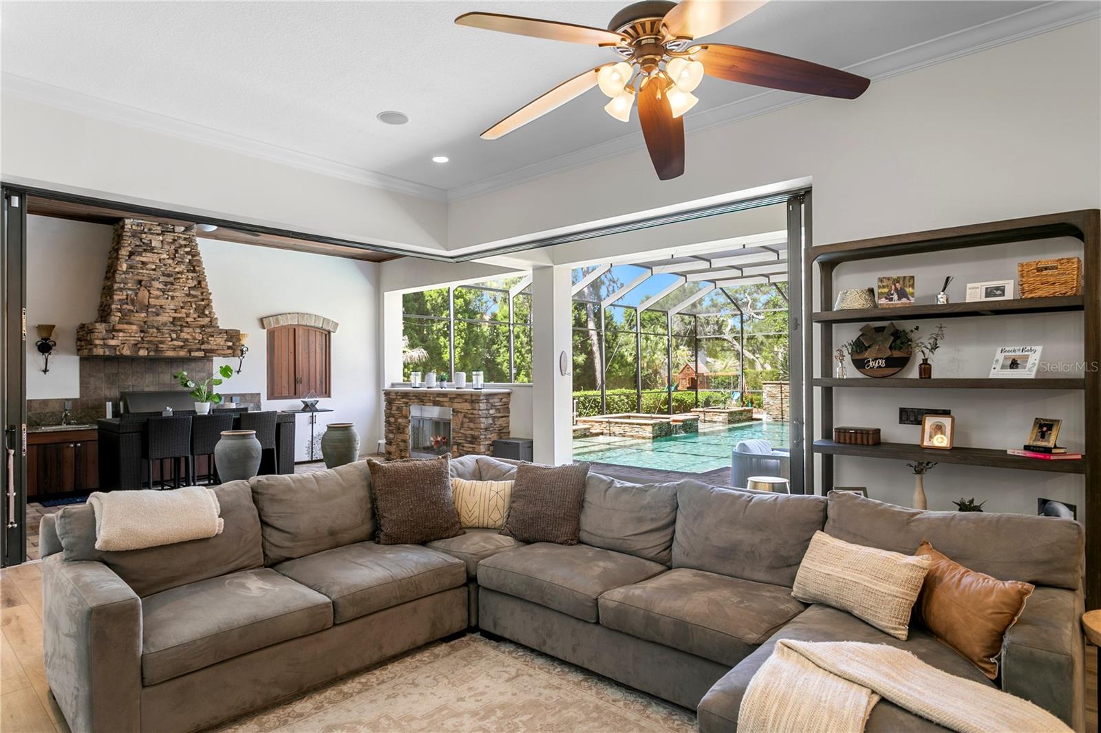 Seamless connection to lanai and pool area.