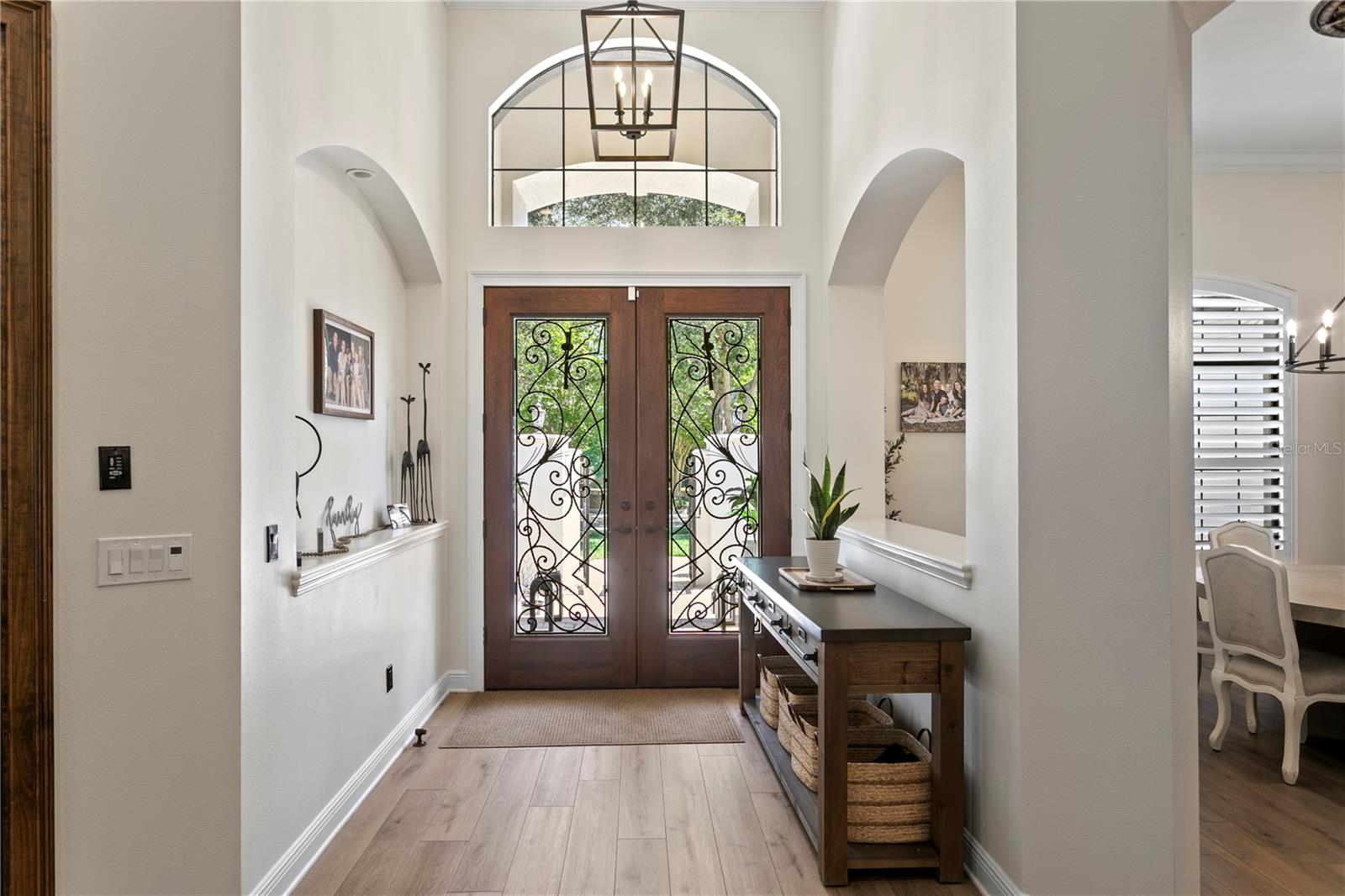 Dramatic entry with soaring ceilings and custom millwork.