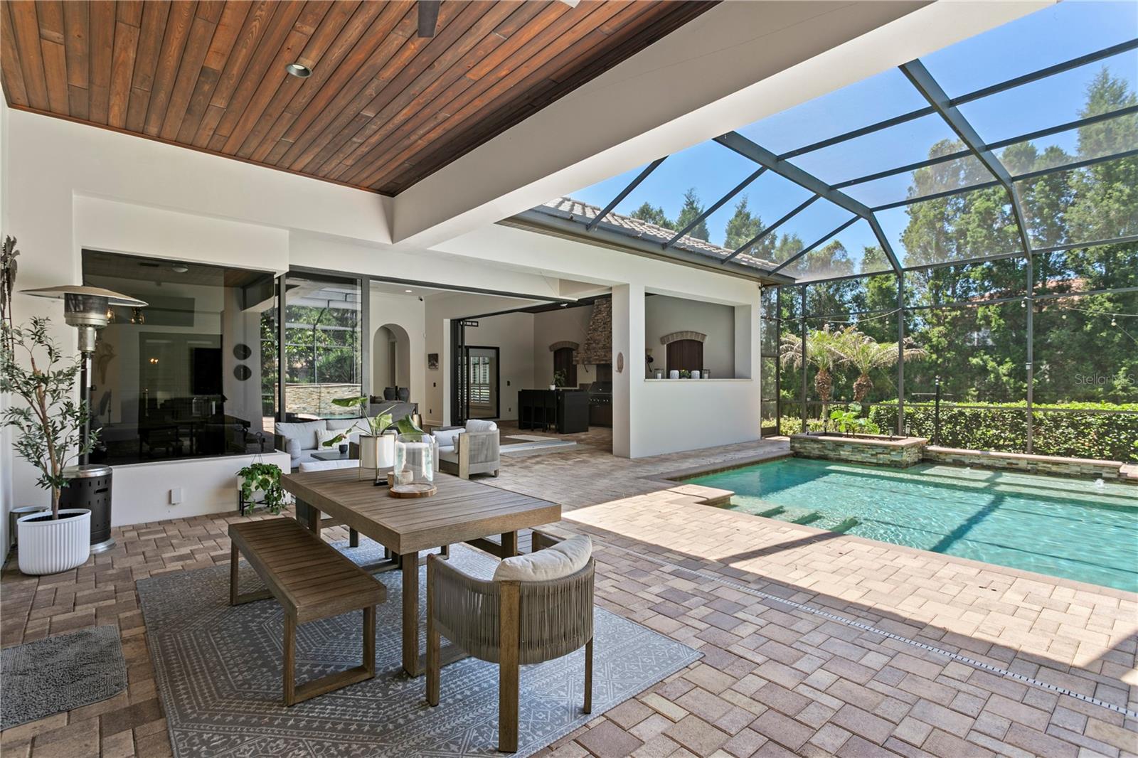 Oversized screened and pavered lanai.