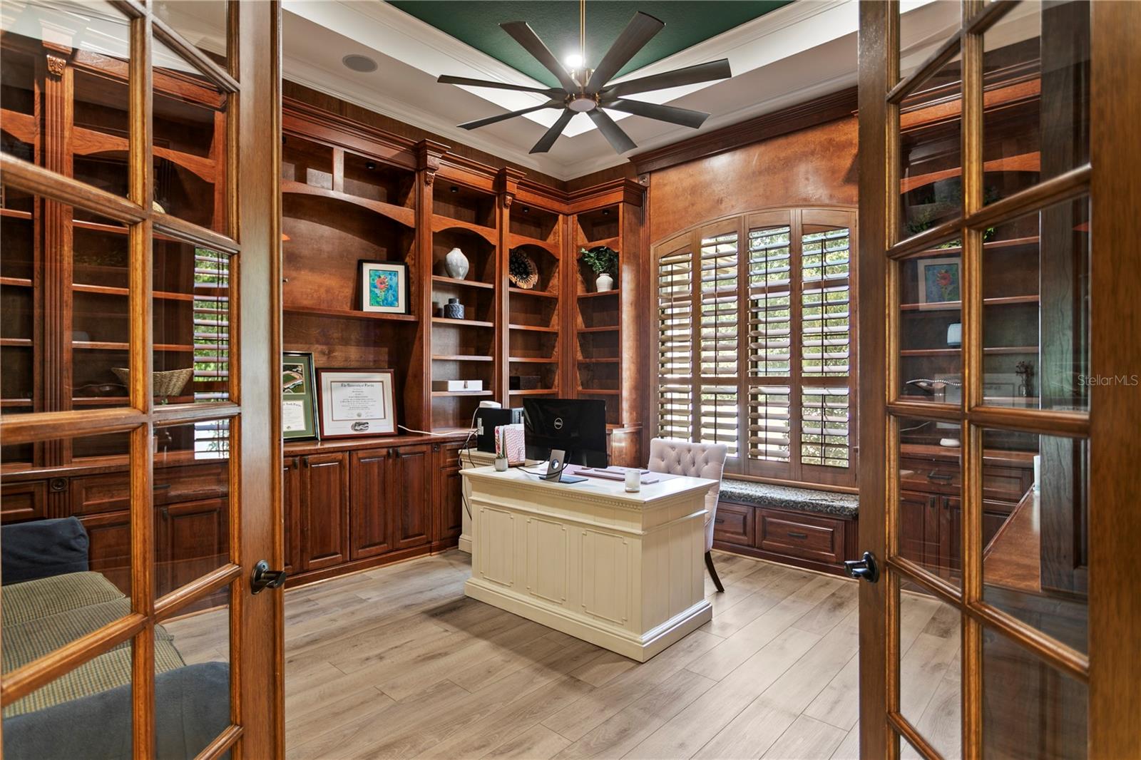 Private office with floor-to-ceiling custom built-ins.