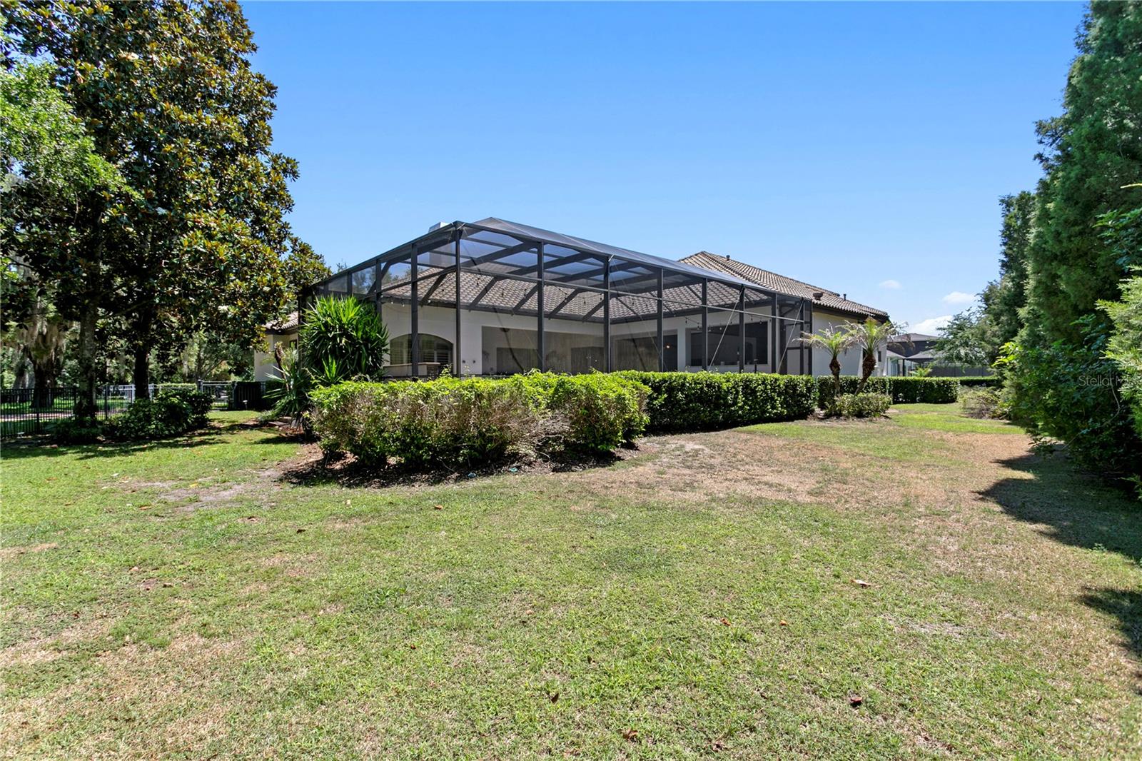 Redesigned landscaping with mature greenery.