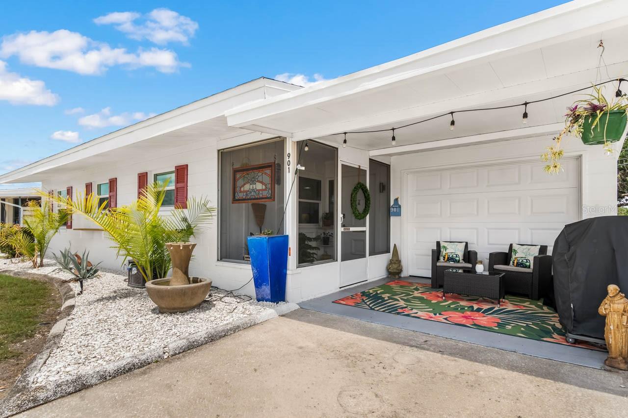 Seating area in front of golf cart garage 901 AUGUSTA DR