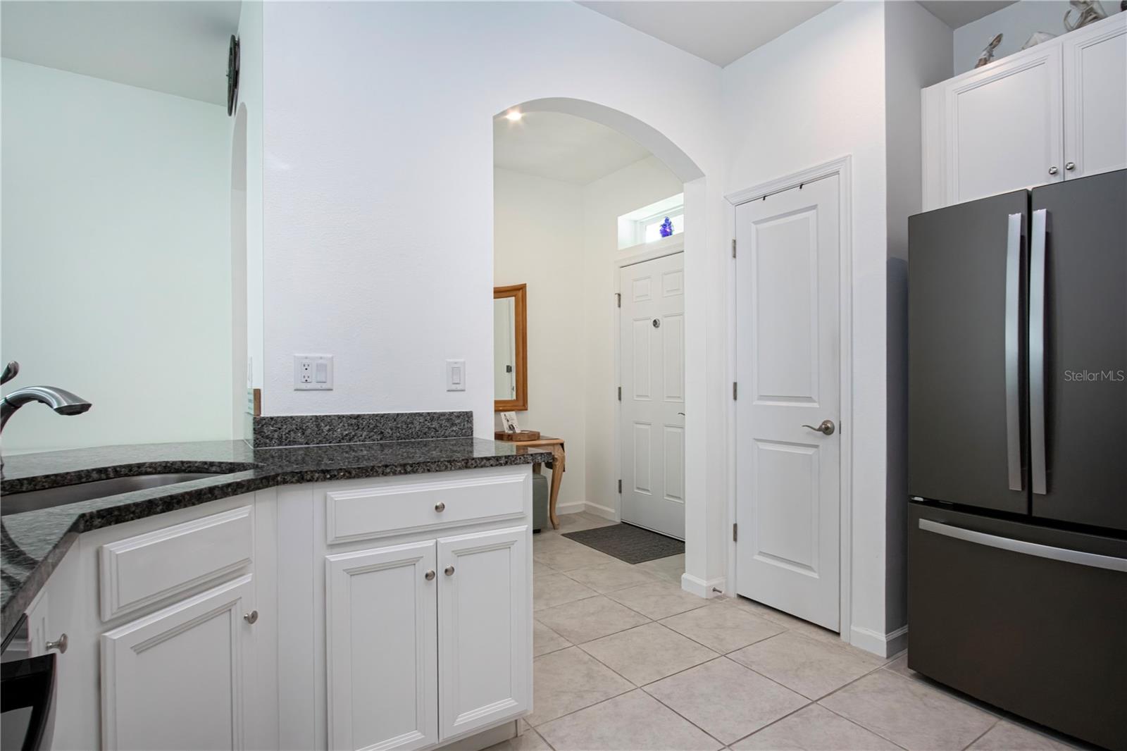Nice pantry behind the door on left of refrigerator