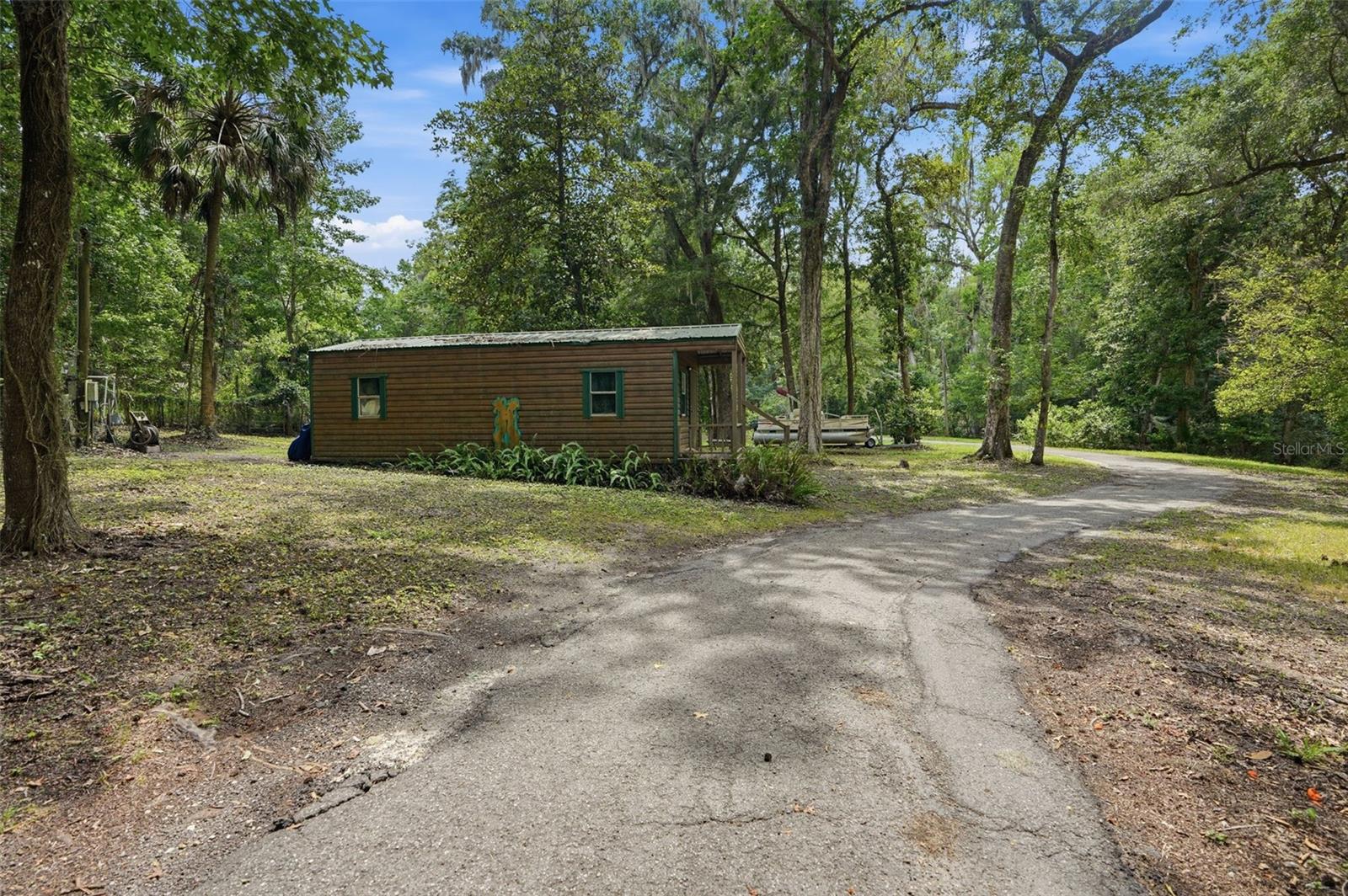 Large shed with front porch and eletric.