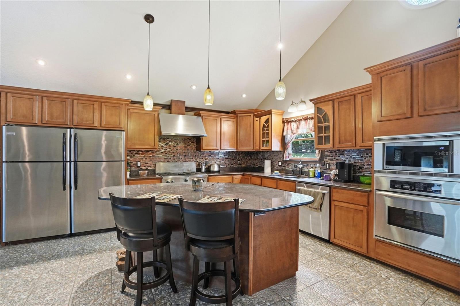 Main Cabin Dining Room with stainless steel appliances and gas stovetop and range hood!