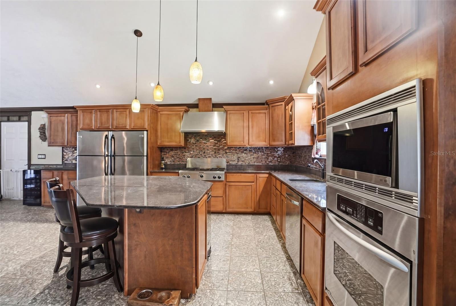 Main Cabin Kitchen with built in oven and microwave with full refrigerator and full freezer...and even a trash compactor.