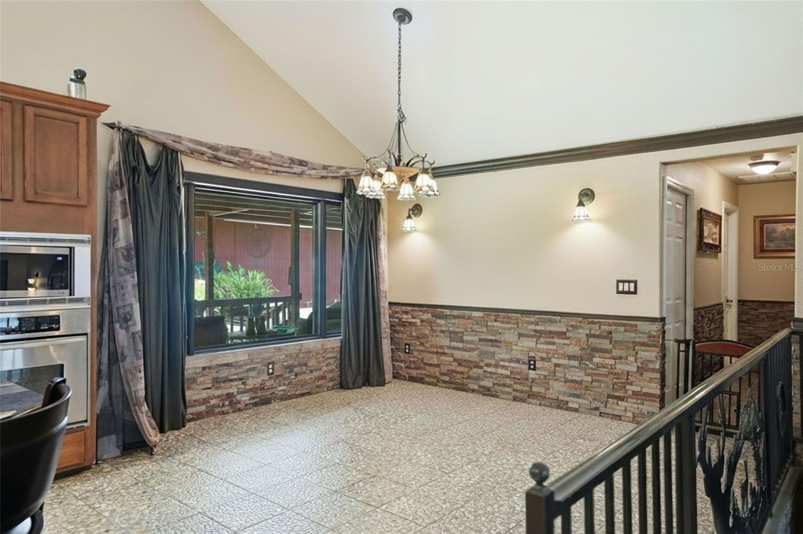 Dining Room with rock accent wall.